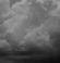Mostly cloudy -  rain showers; cumulonimbus clouds observed